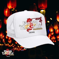 a white trucker hat with a dragon on it